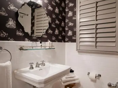 a bathroom with a sink and a mirror at Maison Twenty Seven in Los Angeles