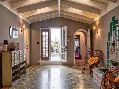 an open hallway with a door and a table and chairs at Maison Twenty Seven in Los Angeles