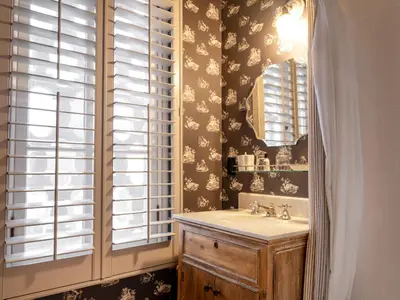 a bathroom with a sink and a mirror at Maison Twenty Seven in Los Angeles