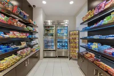 a grocery store aisle with shelves of food and drinks at Embassy Suites by Hilton Anaheim-Orange in Anaheim