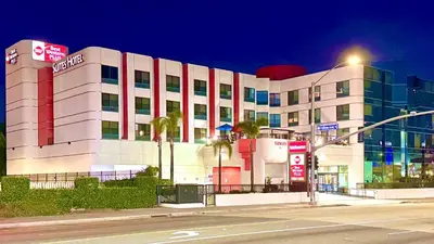 a building on a city street at night at Best Western Plus Suites Hotel - LAX Airport LA Stadium in Inglewood