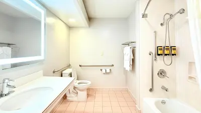 a white bathroom with a sink and a toilet at Best Western Plus Suites Hotel - LAX Airport LA Stadium in Inglewood
