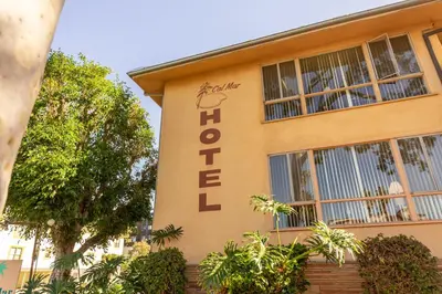 a yellow building with the word hotel on it at Cal Mar Hotel Suites in Los Angeles