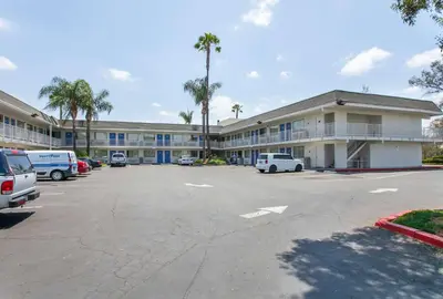 a parking lot in front of a large building at Motel 6-Rosemead, CA - Los Angeles in Rosemead