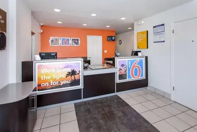 a restaurant with a counter with a light on for you at Motel 6-Rosemead, CA - Los Angeles in Rosemead