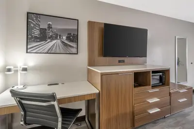 a hotel room with a desk and a tv at Best Western Airport Plaza Hotel – LAX Airport LA Stadium in Los Angeles