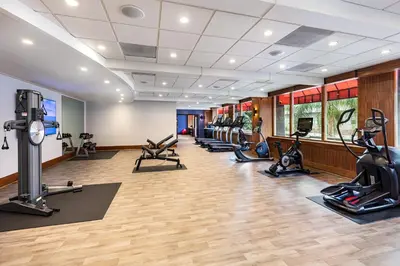 a gym with treadmills ellipticals and exercise bikes at E Central Hotel Downtown Los Angeles in Los Angeles