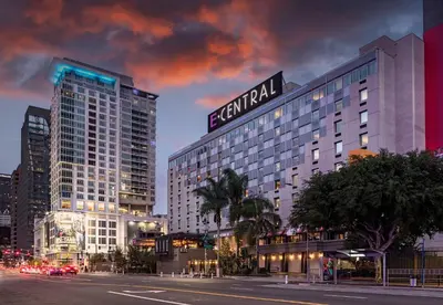 a tall building with a sign on top of it at E Central Hotel Downtown Los Angeles in Los Angeles