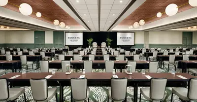 a conference room with a large table and chairs at Sonesta Los Angeles Airport LAX in Los Angeles