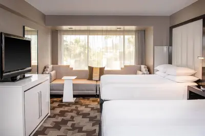 a hotel room with two beds and a television at Beverly Hills Marriott in Los Angeles