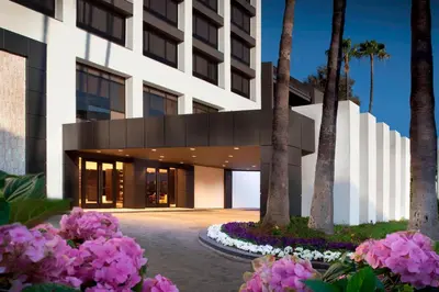 a rendering of the front of a building with pink flowers at Beverly Hills Marriott in Los Angeles
