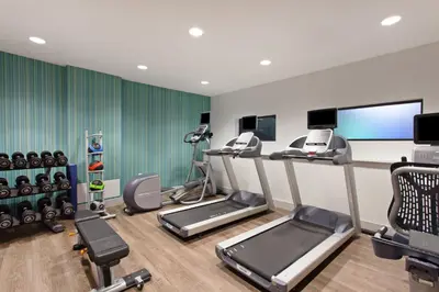 a gym with treadmills and machines in a room at Holiday Inn Express West Los Angeles by IHG in Los Angeles