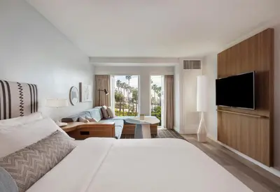 a hotel room with a bed and a television at The Pierside Santa Monica in Los Angeles