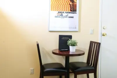 a small table with two chairs and a laptop on it at The Hotel Hollywood in Los Angeles