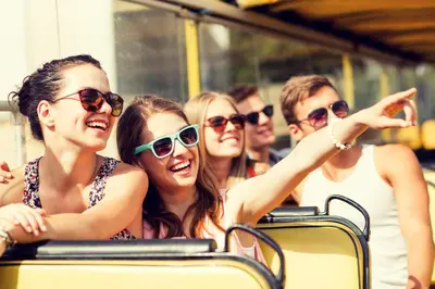 a group of people wearing sunglasses on a bus at The Hotel Hollywood in Los Angeles
