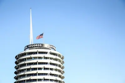 an american flag on top of a building at The Hotel Hollywood in Los Angeles
