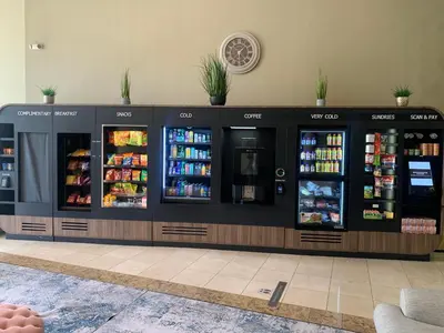 a drink counter in a store with drinks in at Hotel Marguerite South Anaheim - Garden Grove, Trademark Collection by Wyndham in Anaheim