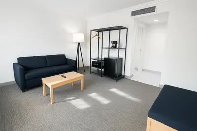 a living room with a couch and a coffee table at The Live Hotel in Los Angeles