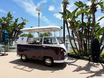 a small vehicle parked on a sidewalk next to trees at Hyatt Regency Long Beach in Long Beach