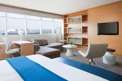a hotel room with a bed and a tv at Hyatt Regency Long Beach in Long Beach
