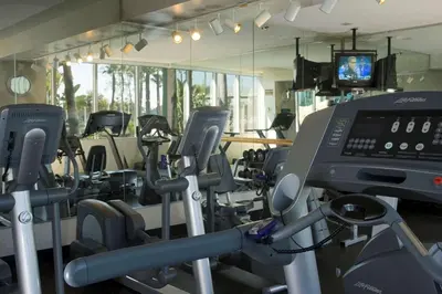 a gym with a bunch of treadmills and cardio machines at Hyatt Regency Long Beach in Long Beach