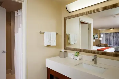 a bathroom with a sink and a mirror at Holiday Inn Express Simi Valley by IHG in Simi Valley