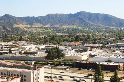 an aerial view of a city with mountains in the background at Hotel Burbank in Burbank