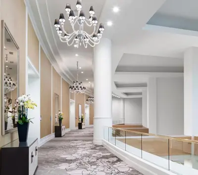a rendering of the lobby of a hotel with a chandelier at The Commerce Casino & Hotel in Commerce
