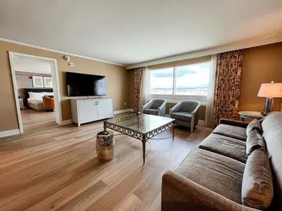 a living room with a couch and a table at The Commerce Casino & Hotel in Commerce