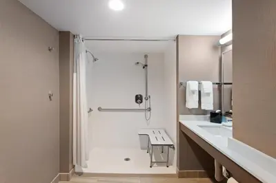 a bathroom with a shower and a sink at Holiday Inn Diamond Bar - Pomona by IHG in Diamond Bar