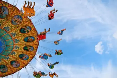a group of people riding on a carnival ride at Holiday Inn Diamond Bar - Pomona by IHG in Diamond Bar