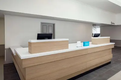 an office with a reception desk with a laptop on it at Hilton Garden Inn Arcadia/Pasadena Area in Arcadia