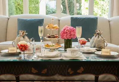 a table with a tray of food on it at The Peninsula Beverly Hills in Los Angeles