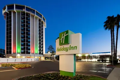a hotel sign in front of a building at Holiday Inn Long Beach - Airport by IHG in Long Beach