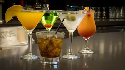 a group of three cocktails sitting on a bar at Holiday Inn Long Beach - Airport by IHG in Long Beach
