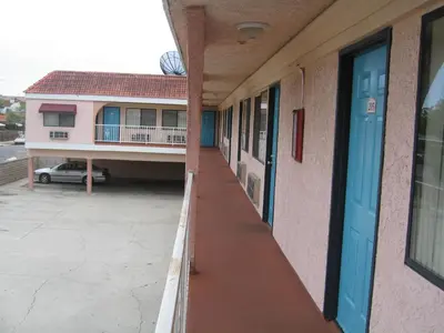 an empty hallway of a school building with a parking lot at Royal Inn Motel Long Beach in Long Beach