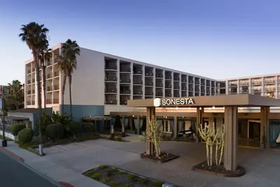 a hotel with a sign in front of a building at Sonesta Redondo Beach and Marina in Redondo Beach