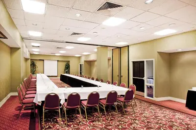 a large conference room with a long table and chairs at Holiday Inn Los Angeles Gateway-Torrance by IHG in Torrance
