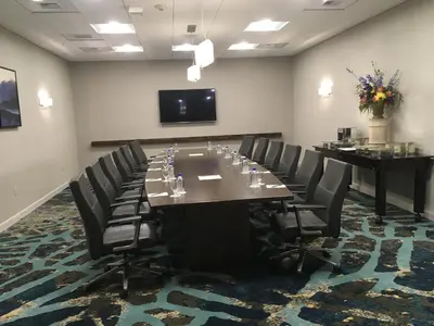 a conference room with a long table and chairs at Crowne Plaza Ventura Beach by IHG in Ventura