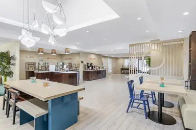 a lobby of a store with tables and chairs at Sonesta ES Suites Chatsworth in Chatsworth