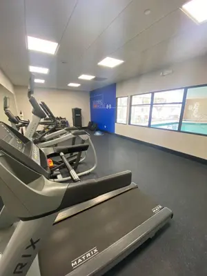 a gym with treadmills and a treadmill at Holiday Inn Express Hotel & Suites Hermosa Beach by IHG in Hermosa Beach