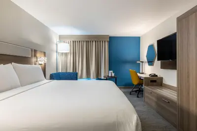 a hotel room with a bed and a desk at Holiday Inn Express Van Nuys by IHG in Van Nuys