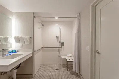 a bathroom with a sink and a shower at Holiday Inn Express & Suites Pasadena - Los Angeles by IHG in Pasadena