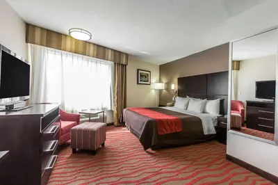 a hotel room with a bed and a flat screen tv at Comfort Inn Los Angeles near Hollywood in Los Angeles