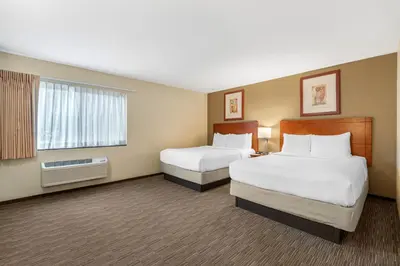 a hotel room with two beds and a window at Comfort Inn Cockatoo Near LAX Airport in Hawthorne