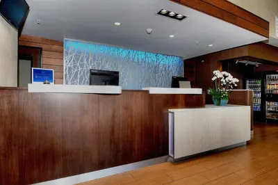 a lobby of a store with a reception desk and a glass wall at Fairfield Inn & Suites by Marriott Los Angeles Rosemead in Rosemead