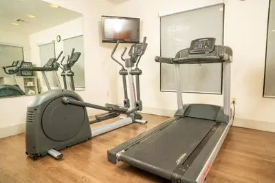a gym with cardio equipment and a treadmill at Holiday Inn Express Hotel & Suites Hesperia by IHG in Hesperia