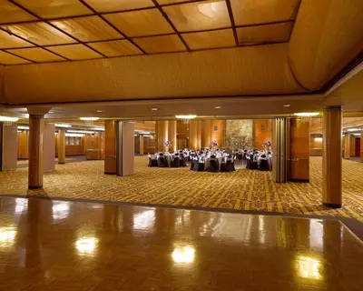 a large banquet hall with tables and chairs at The Queen Mary in Long Beach