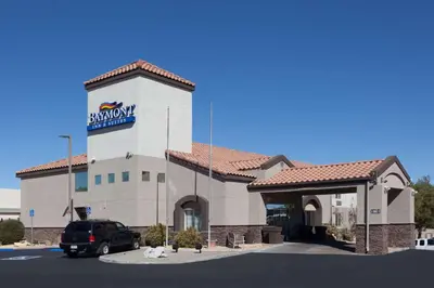 a building with a sign on the side of it at Baymont by Wyndham Barstow Historic Route 66 in Barstow