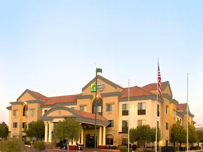 a building with a flag in front of it at Holiday Inn Express & Suites Barstow - Route 66 by IHG in Barstow